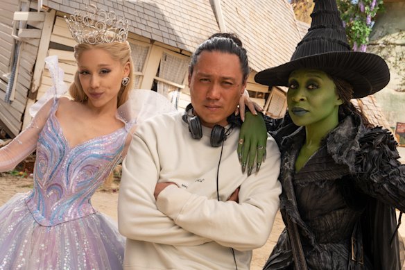 Ariana Grande, director Jon M. Chu and Cynthia Erivo on the set of Wicked: For Good.