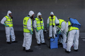 Spanish Royal Guard soldiers disinfect a hospital to prevent the spread of the coronavirus in Madrid.