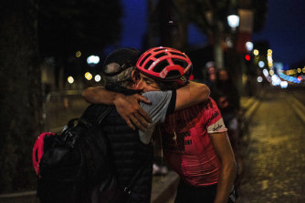 Morton is congratulated after his arrival in Paris, after 19 days of solo riding.