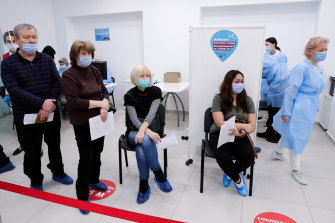 In Moscow, people line up for a Sputnik jab, which they don’t have to make an appointment for at this shopping plaza pop-up. 