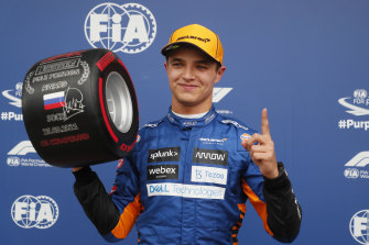 Lando Norris celebrates his first pole position.