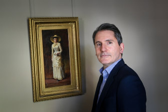 Geoffrey Smith, chairman Smith & Singer, next to Frederick McCubbin’s painting The Letter (1884).