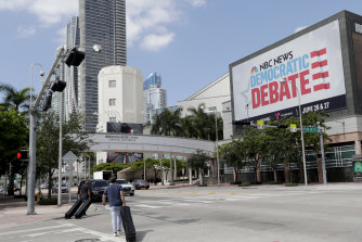 A billboard advertises the Democratic presidential debates across from the Knight Concert Hall at the Adrienne Arsht Centre in Miami.