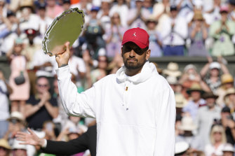 Australia’s Nick Kyrgios holds his runners-up trophy.