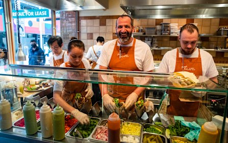Former Rockpool chef Simon Zalloua (middle) on the tools at Jimmy's Falafel. 