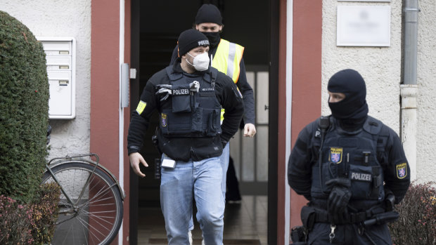 Police officers at a property in Frankfurt during a raid against far-right extremists.