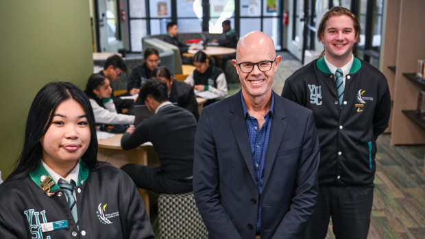 Year 12 captains Rebecca Tat and Kyle Marshall with Victoria University Secondary College assistant principal  James Dowie.