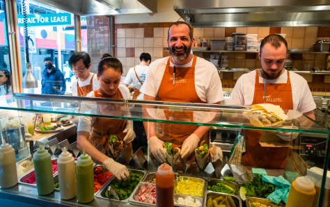 Former Rockpool chef Simon Zalloua (middle) on the tools at Jimmy's Falafel. 