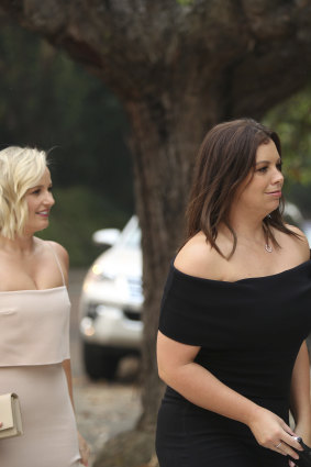 Fox Sports presenters Jessica Yates, left, and Yvonne Sampson arrive at the Bellevue Hill home of Lachlan and Sarah Murdoch for Christmas drinks.