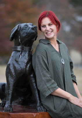 Designer Amanda Gibson with sculpture of Justin the tracker dog at Greensborough War Memorial Park.