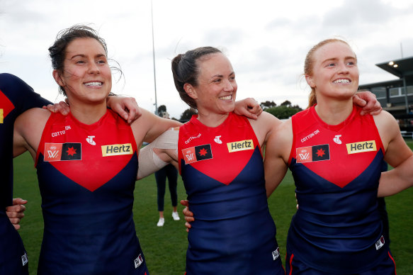 Libby Birch, left, pictured last season with Demons teammates Daisy Pearce, centre, and Blaithin Mackin.