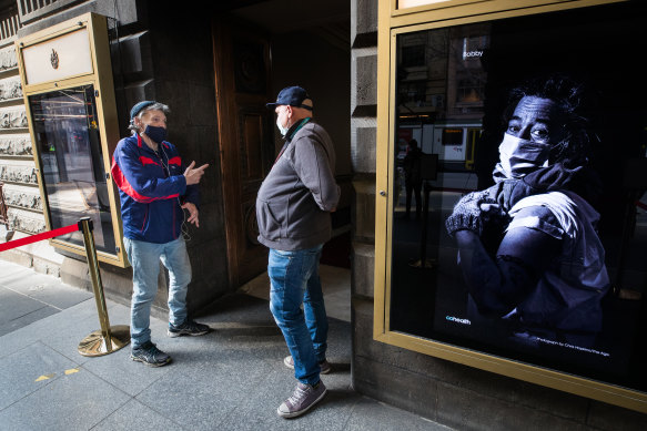 Peer support worker Jimmy Rose (right) chats to his friend, Greg, outside Melbourne’s new vaccine centre dedicated to the city’s homeless and disadvantaged.