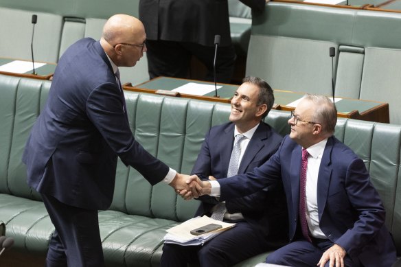 Opposition Leader Peter Dutton shakes hands with Prime Minister Anthony Albanese in between divisions in the House of Representatives.