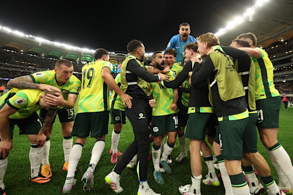 The Socceroos celebrate.