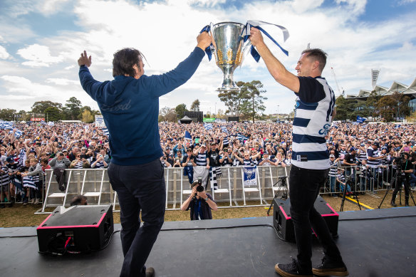 Geelong coach Chris Scott and captain Joel Selwood present the premiership cup to Cats fans at Kardinia Park.