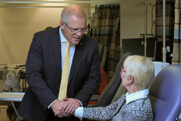Prime Minister Scott Morrison speaks to cancer sufferer Pernille Jensen during a tour of the Northern Cancer Institute in Sydney on Monday.