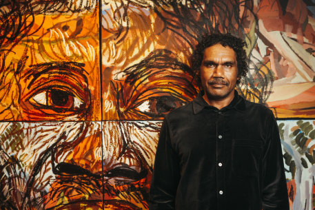 Vincent Namatjira with “Self-Portrait” (2022).