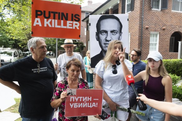 Pro-Navalny protestors held banners saying “Putin is a killer”.