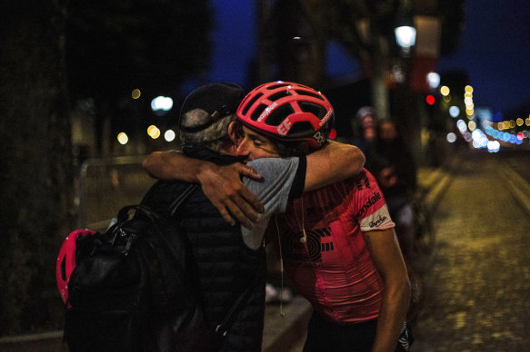 Morton is congratulated after his arrival in Paris, after 19 days of solo riding.