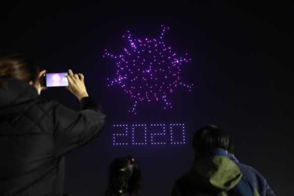 Drones fly over the Olympic Park make the shape of coronavirus to send messages to support the country and share measures to contain the spread of the coronavirus in Seoul, South Korea. 