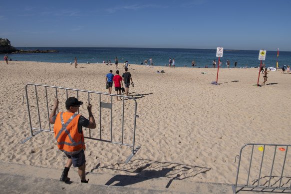 Barricades were set up to stop people congregating on the stairs at Coogee Beach on Tuesday.