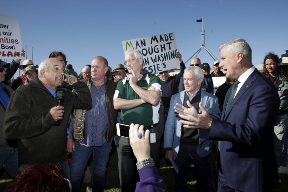 A man berates Deputy Prime Minister Michael McCormack as he meets with members of the farming community.