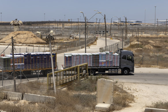 A truck loaded with humanitarian aid moves into the Gaza Strip at the Kerem Shalom border crossing.