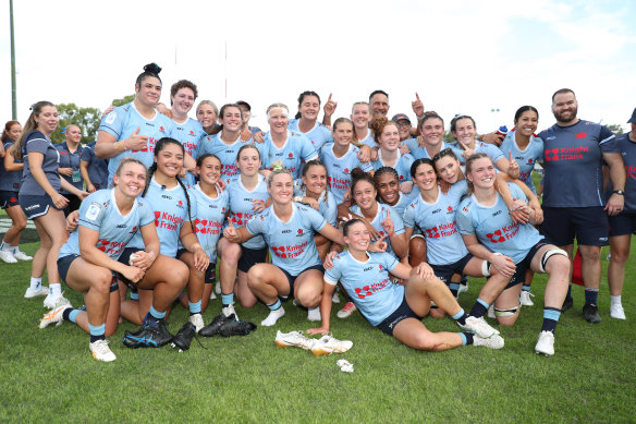 The Waratahs celebrate their Super Rugby Women’s grand final victory on Sunday. 