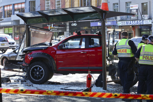 A man in his 70s is in a critical condition after a car smashed into a bus shelter in a busy Sydney street. 