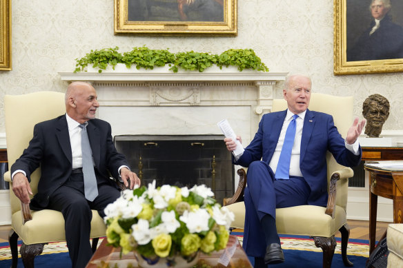 US president Joe Biden meets with Afghan President Ashraf Ghani, left, in the Oval Office. 