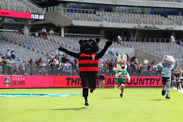 Perth Bears mascot Kodi wins a race against South Sydney’s Reggie the Rabbit and Reefy of the Cronulla Sharks at Optus Stadium.