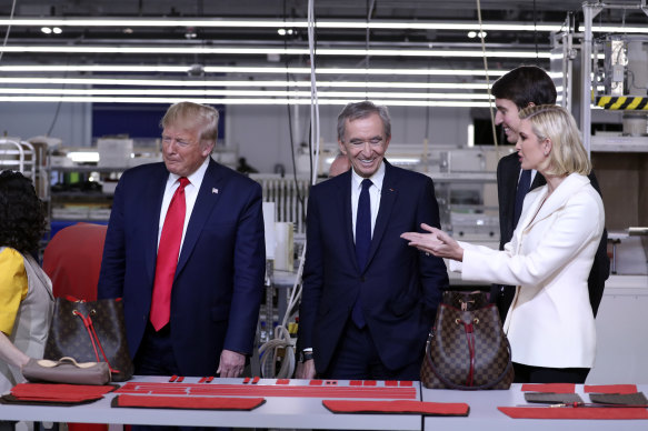 Donald Trump with Bernard Arnault and daughter Ivanka at a Louis Vuitton workshop in Texas in 2019.