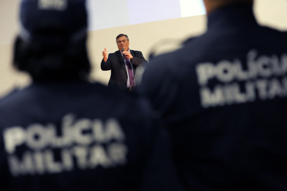 Justice Minister Flavio Dino speaks during a tribute to security professionals who worked to defend public buildings stormed by Bolsonaro supporters.