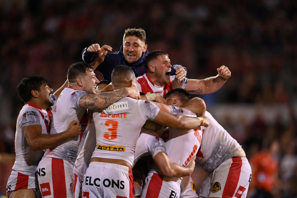 Jubilant St Helens players celebrate their dramatic win on Saturday night.