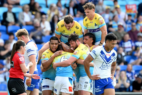 The Titans celebrate one of Kieran Foran’s three tries - his first career hat-trick.