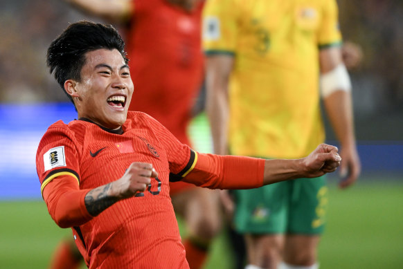 Wenneng Xie celebrates scoring against the Socceroos in October.