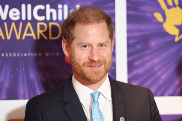 Prince Harry smiles as he attends the Wellchild Awards.