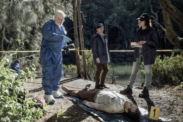 William McInnes, Todd Lasance and Olivia Swann with one of NCIS’s signature dead bodies. 