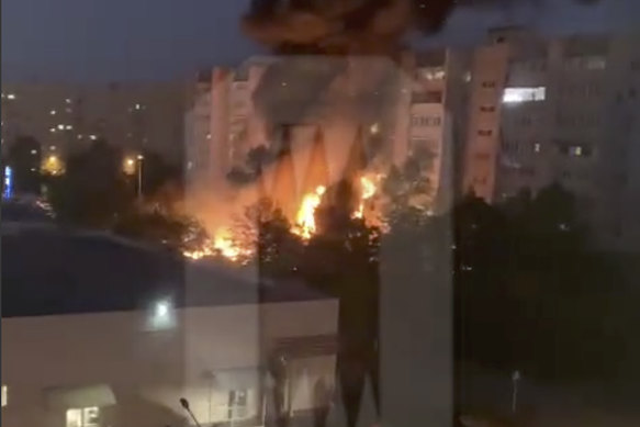 Flames and smoke engulf a building after a warplane crashed into a residential area in Yeysk, Russia.