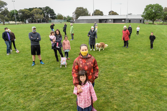 Tatiana Stephens and daughter Elfie with unhappy locals at Hosken Reserve.