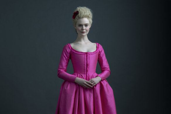 Fanning, pretty in pink, as Catherine the Great, Empress of Russia.