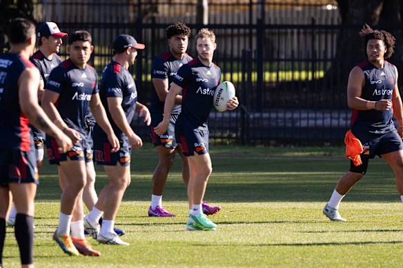 Sam Walker and the Roosters train at Kippax Lake Field on Tuesday.