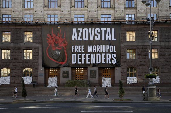 A banner calling for the release of the captured Ukranian armed forces from Mariupol, hangs on the front of the Kyiv city administration building in Kyiv.