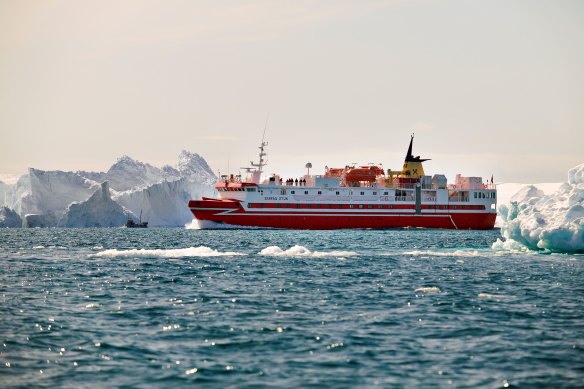 One of Arctic Umiaq’s coastal ferries among icebergs in Greenland’s Ilulissat Icefjord.