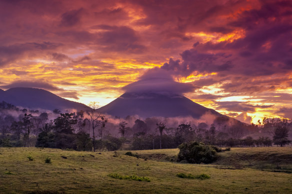 The Arenal volcano at sunset.