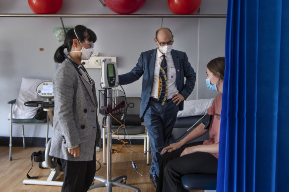 Doctors meet with a patient at the long COVID clinic in St Vincent’s Hospital in Sydney.