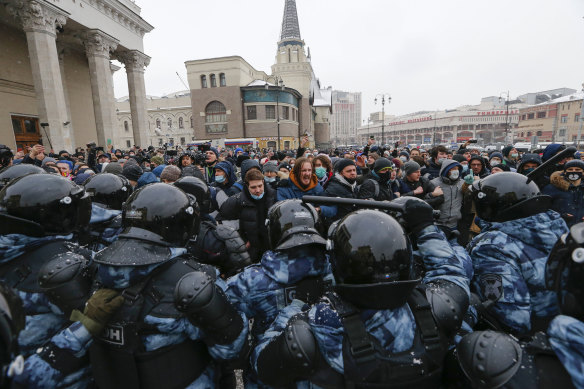 People clash with police In Moscow during a protest against the jailing of opposition leader Alexei Navalny held earlier in the year.