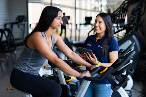 Sara Chica-Latorre (right) divides her time between working and studying full-time at Canberra University.