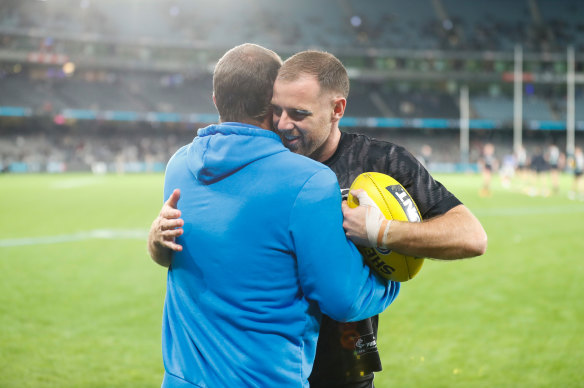 Ben Cunnington and Sam Docherty embrace before the Roos-Blues clash in round seven.