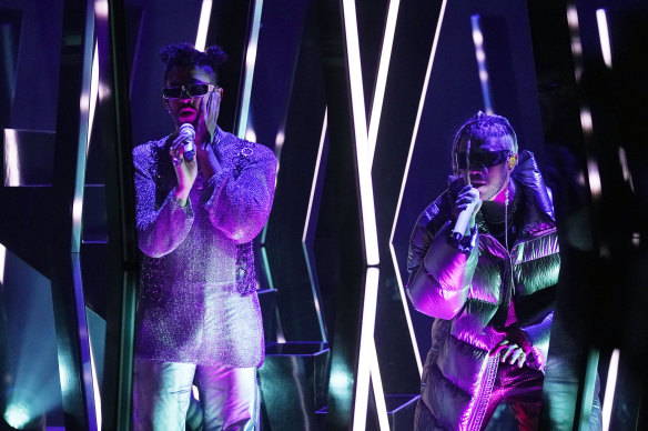 Bad Bunny, left, and Jhay Cortez perform “Dakiti” at the Grammy Awards.